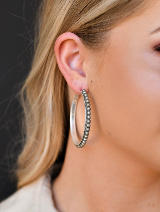 Worn Silver Trimmed Hoop Earring